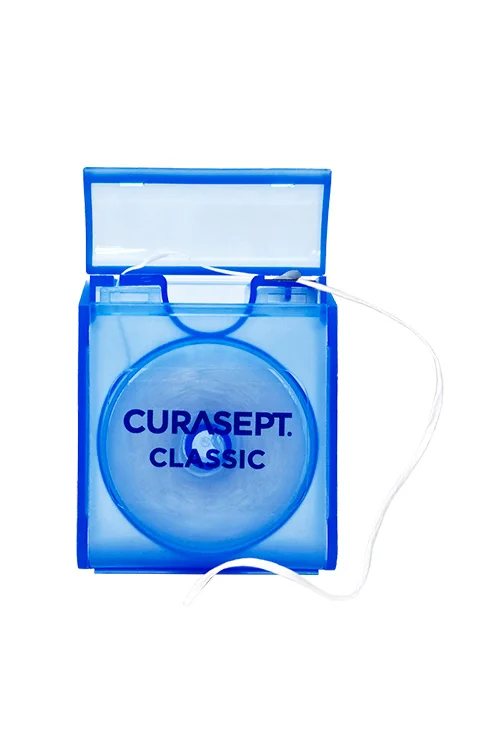 Зубная нить Curasept Classic вощеная CHX 0,2% со вкусом мяты 50м